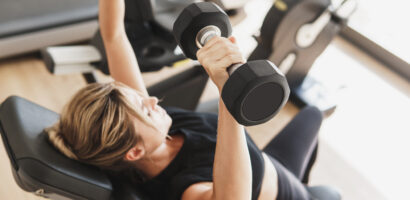 Young athletic woman doing strength training exercises